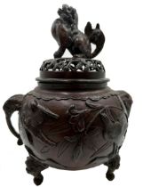 Japanese bronze lidded Koro, mounted by a temple god, cast in relief with birds and twin elephant