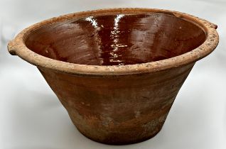 Large 19th century terracotta dairy bowl with glazed interior, 30cm high x 61cm diameter