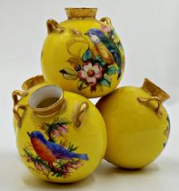 Royal Worcester porcelain stylised tulip vase in the form of four urns, hand painted with birds on a