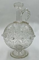 Good quality Arts and Crafts glass claret jug in the manner of Christopher Dresser with geometric