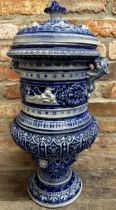 Large Rhine ware pottery twin handled lidded pot, with panels of figures and foliage upon a blue