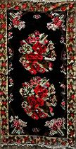 Good quality possibly Balkan flat weave carpet, with roses on a black ground L395 x W190