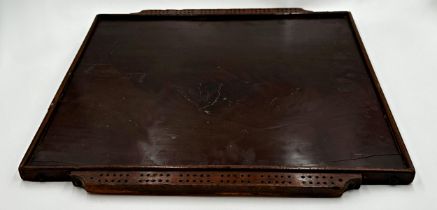 Antique plum pudding mahogany games board with markers to either side, 56cm x 52cm.