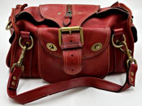 A vintage Mulberry Emmy shoulder bag in oxblood leather. Gold tone hardware with top flap magnetic