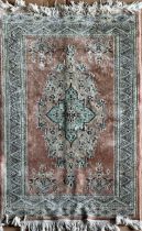 Persian silk blend Keshan rug, large central medallion and darted boarders on pink ground, L174 x