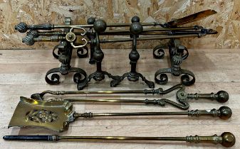 Two sets of three brass fire irons together with two pairs of fire dogs (10)