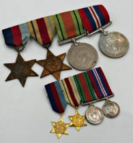 Four WWII war medals with matching miniatures with ribbons and bar, to include The Africa Star (2)