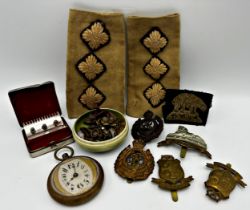 Mixed cabinet lot to include an Art Deco brass cased pocket watch with shaped mount and Arabic