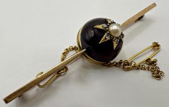 Antique 9ct bar brooch, with large garnet fitted with a pearl framed by diamonds, 6.5cm long, with