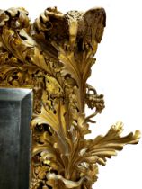 The most remarkable 19th century giltwood and gesso Florentine wall mirror, deeply carved with birds