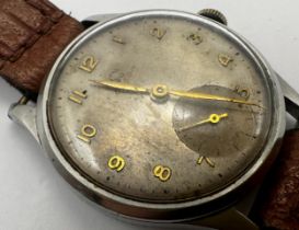 Late 1940s Omega stainless steel gents dress watch, 33mm case, tropical silver dial with gilt