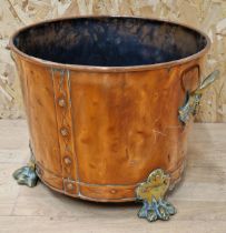 Good antique copper and twin brass handled log bucket upon rivetted brass paw feet, 29cm high