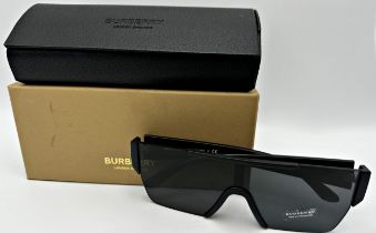 A pair of oversized unisex Burberry sunglasses with matte glass and rectangular design. Model number