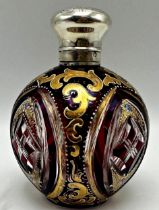 Antique continental bohemian cranberry glass scent bottle with silver lid and gilt and enamel