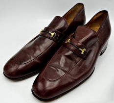 A pair of men's brown leather Gucci loafers with gold-tone hardware, size 43. Have been re-soled and