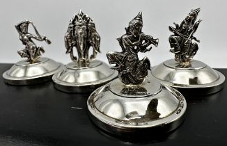 Cased set of six Siam sterling silver menu holders, each mounted by a theatrical character on