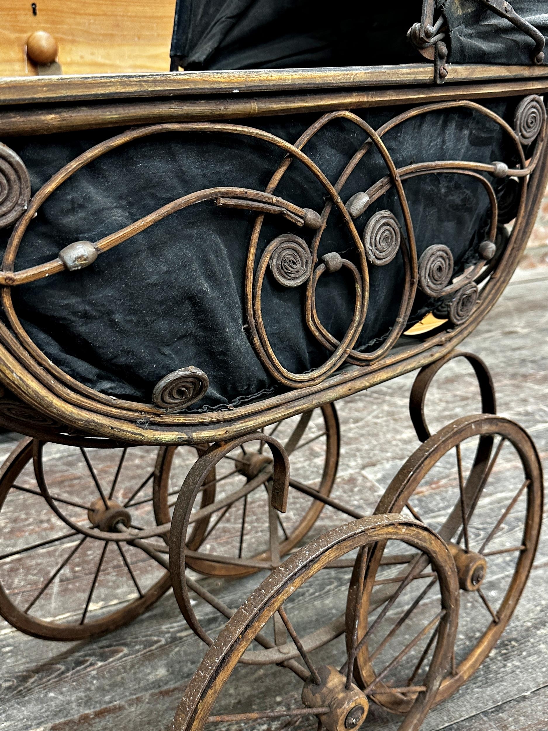 Antique wicker pram with pierced scrolling detail and fabric hood, 88cm high - Image 3 of 3