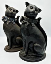 A pair of cast iron doorstops in the form of seated cats, H 38cm
