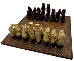 Large novelty resin chess set, of various wild animals in human dress, height of king 19cm, on a