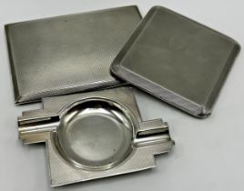 Two engine turned silver cigarette cases, together with an Art Deco ashtray, 12oz approx