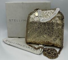 Stella McCartney mini Falabella gold glitter top handle tote bag with gold tone hardware, pink