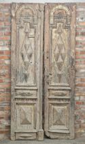 Large pair of late 17th century Continental Mediterranean doors, with embossed panels and traces