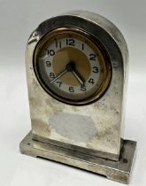 1920s silver cabinet clock, arched form, gilt dial with Arabic numerals, maker MH, Birmingham