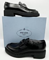 A pair of Prada black brushed leather chunky loafers with iconic enamelled triangle logo, size 40.