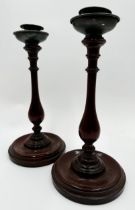 Pair of 19th century turned mahogany candlesticks, 30cm high