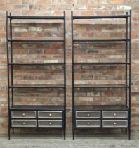 Pair of India Jane contemporary black metal open shelving units with four drawers to base, H 200cm x