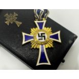 Third Reich interest- Nazi mother honours cross, dated 16th December 1938 verso upon a blue and