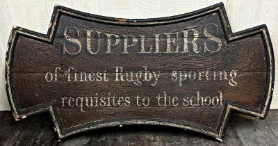 Antique wooden shop sign inscribed "Suppliers of the Finest Rugby Sporting Requisites To the