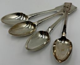 Three William IV silver fiddle dessert spoons with a further Irish regency period silver spoon,