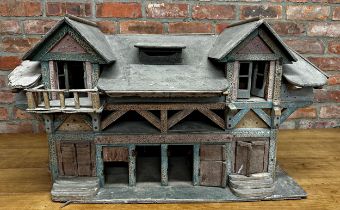 Good large Folk Art dolls house of a stable building, with original paint and shutter doors and