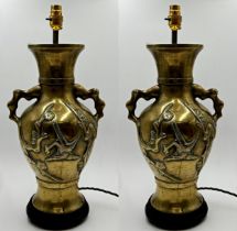 Pair of Japanese cast brass twin handled baluster table lamps decorated with birds amidst foliage,