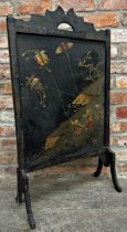 Early 20th century Chinoiserie fire screen, decorated with three men flying kites, 90 x 51cm