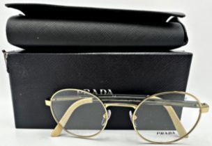 A pair of Prada woman's eyeglasses with gold metal rounded frames. Model number VPR 52X. In unused