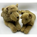 Vintage straw stuffed recumbent lion, tail to head 603cm, with a similar lioness (2)