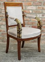 Empire style upholstered open armchair with gilt painted detail raised on sabre legs, H 97cm x W