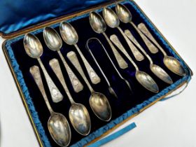 Good quality Arts & Crafts Scottish silver cased suite of twelve teaspoons and sugar tongs, with