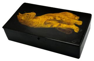 Early 20th century lacquered box, the hinged lid decorated with a seated cat, button clasp, 26cm