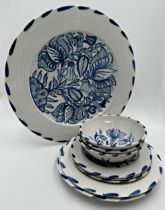 Isis blue and white pottery with delft tulip decoration, three bowls, three side plates, two