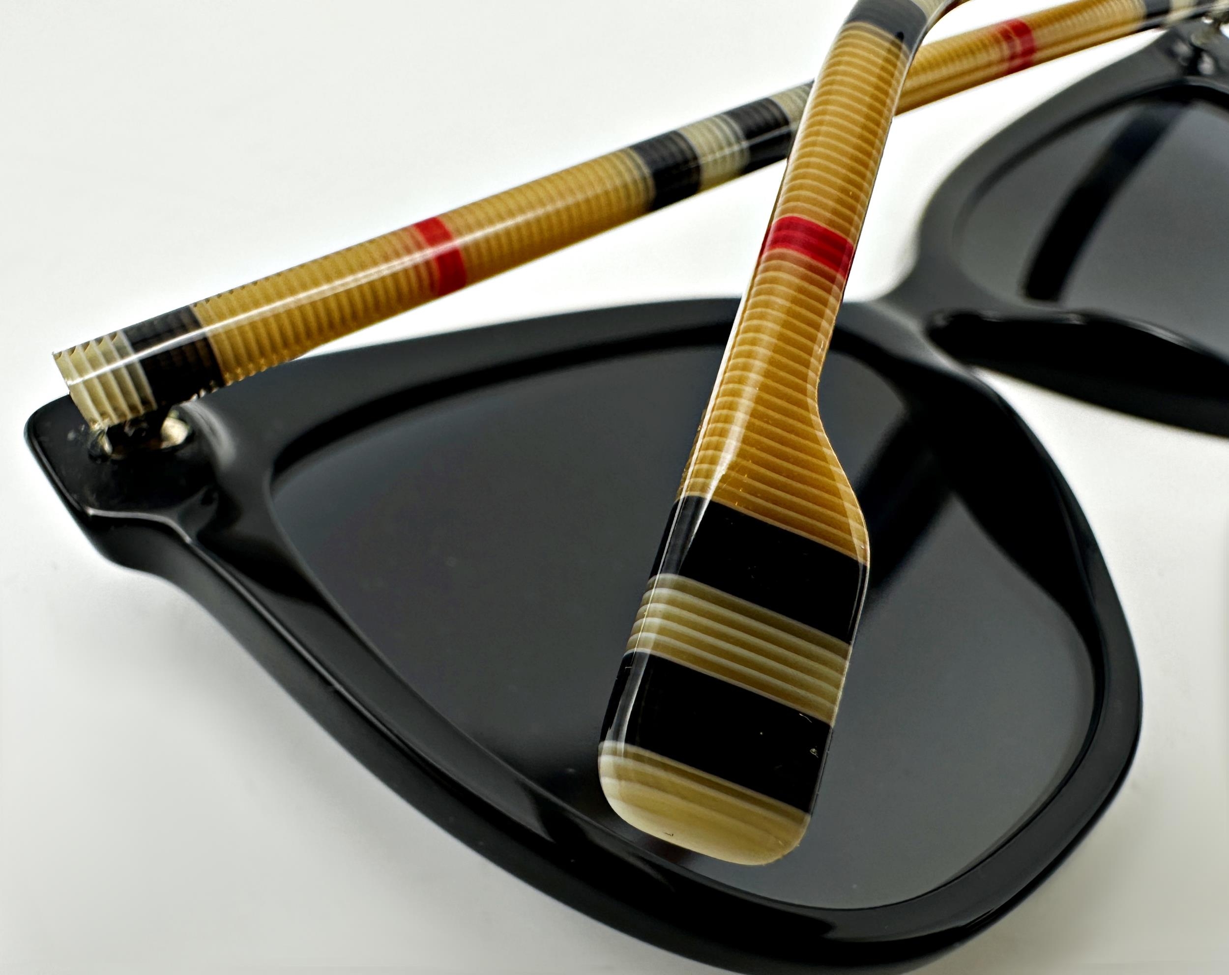 A pair of Burberry Clare sunglasses with black frames and Burberry check temples. In unused - Image 5 of 5