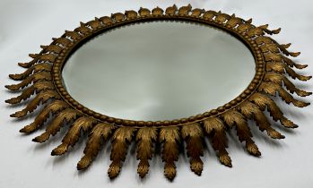 Spanish gilt metal circular sun burst wall mirror with leaf and beaded detail, W 71cm