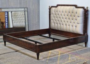 Theodore Alexander oversized bed frame with cushioned headboard, turned columns and pineapple