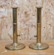 Pair of antique brass ejector candlesticks, 22cm high (2)