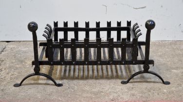 Black painted cast iron fire grate with fire dogs, H 36cm x W 83cm x D 45cm