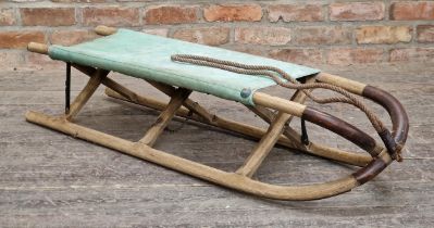 Possibly military vintage wooden sledge with canvas seat, 126cm wide