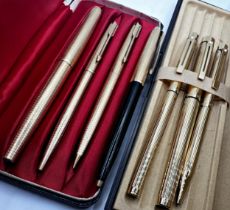Parker and Sheaffer three piece pen sets, the fountains with 14k nibs, with a further Parker pen