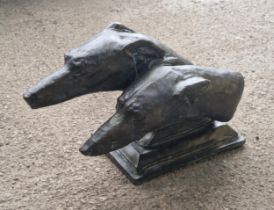 Composite stone study of two greyhound heads on a rectangular plinth with simulated bronze finish, H